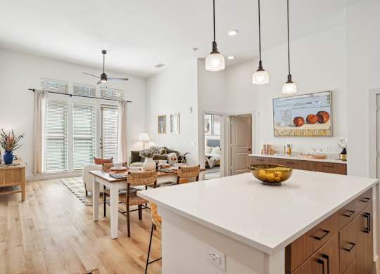 A modern kitchen with a dining table and chairs.