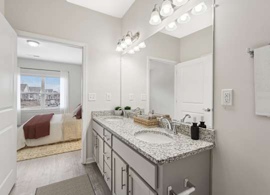 A bathroom with a large mirror, a sink, and a window.