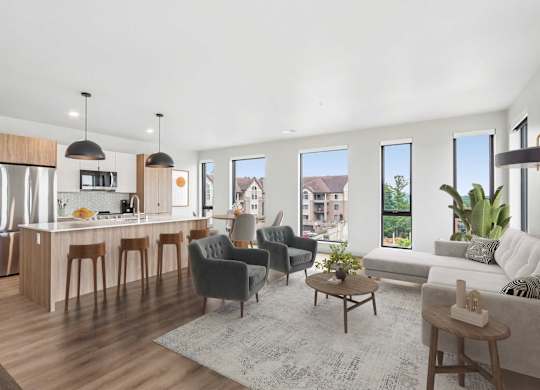 A modern kitchen with a dining area and a living room.