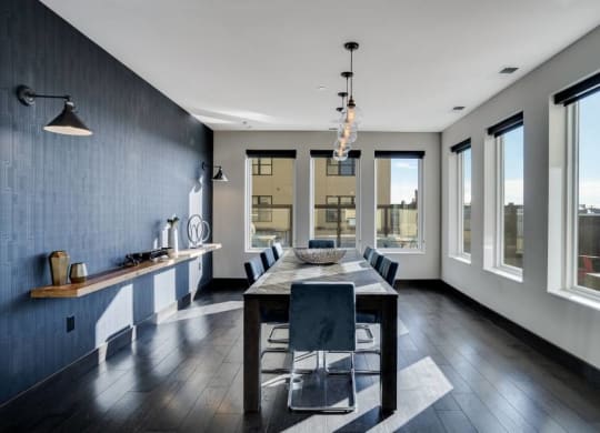 a dining room with a table and chairs and a large window C&E Living in St Paul, MN