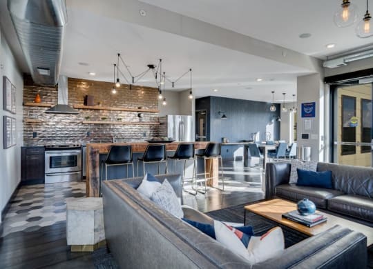 a large living room with a kitchen and a dining room C&E Living in St Paul, MN