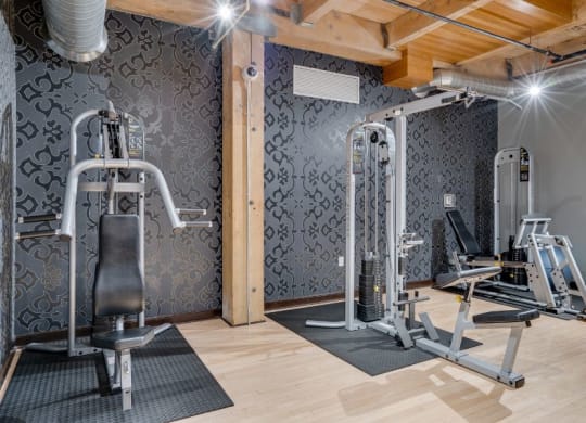 Gym with various weightlifting equipment C&E Living in St Paul, MN
