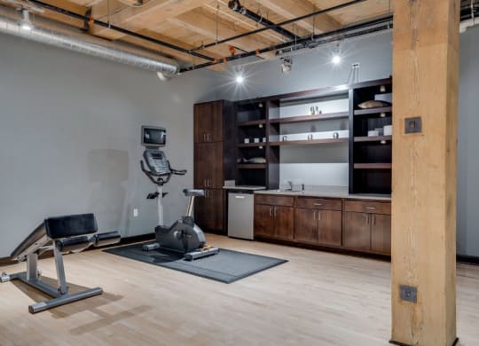 Gym with various cardio equipment C&E Living in St Paul, MN
