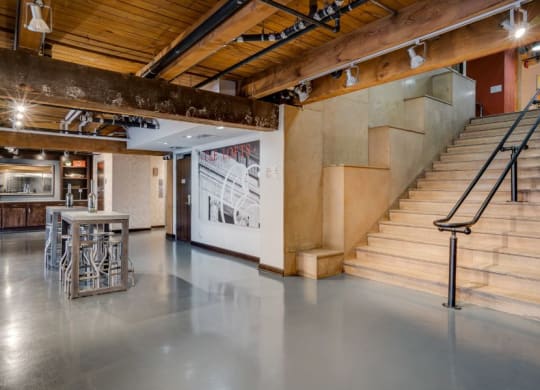 the lobby of a building with a staircase and a staircase C&E Living in St Paul, MN