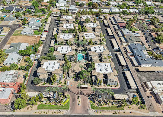 A bird's eye view of a residential neighborhood with houses and streets.