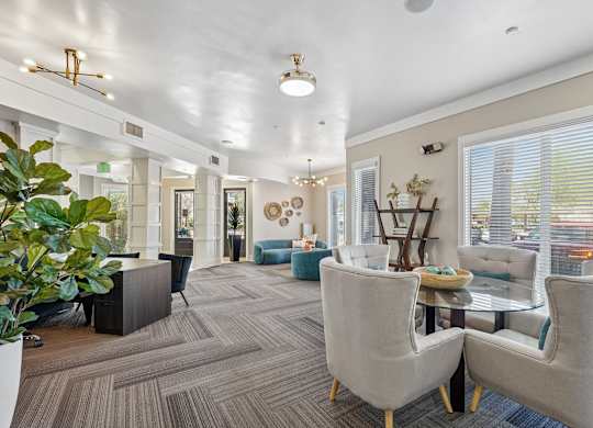 A spacious waiting room with comfortable seating and a large window.