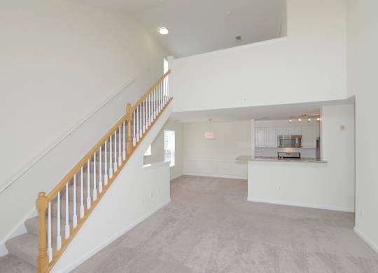 Large open floorplan with a staircase leading to the upper loft