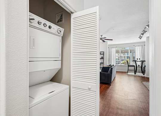 A white oven and dishwasher in a kitchen.