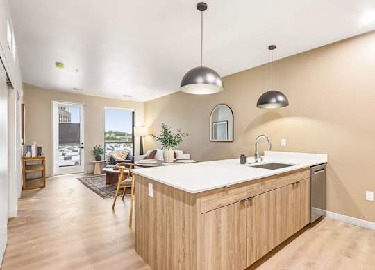A kitchen with wooden cabinets and a white countertop.