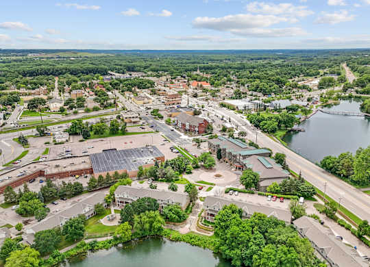 A bird's eye view of a town with a river running through it.