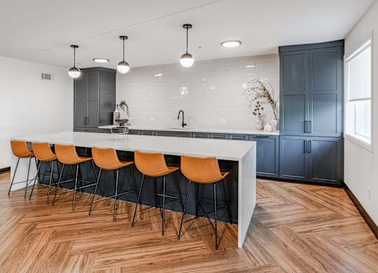 a kitchen with a white counter top and blue cabinets