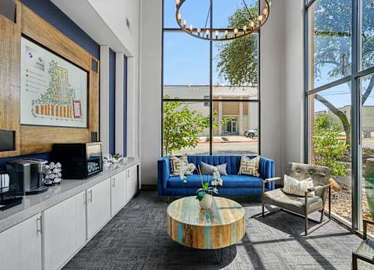 A modern living room with a large window and a view of the outdoors.