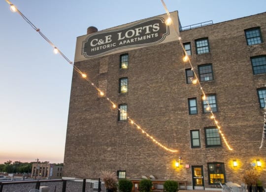 a building with a sign on the side of it C&E Living in St Paul, MN