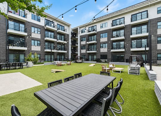 Big green lawn in front of a building at Markethaus 3700 in Plano Texas