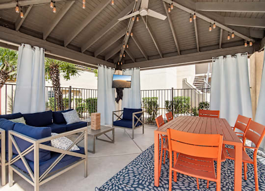 A patio with a table and chairs.