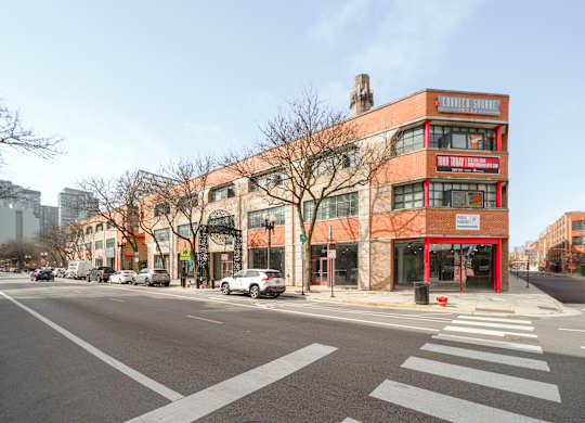 A street view of a red building with the words "COLORADO SPRINGS" on it.