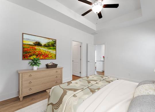 A bedroom with a large bed and a painting on the wall.