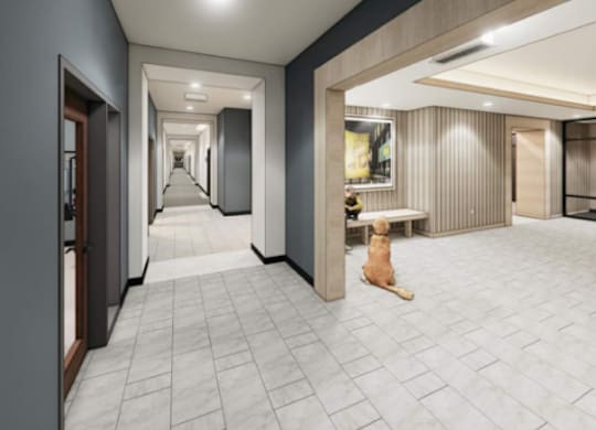 A dog is sitting in a hallway with a tiled floor.