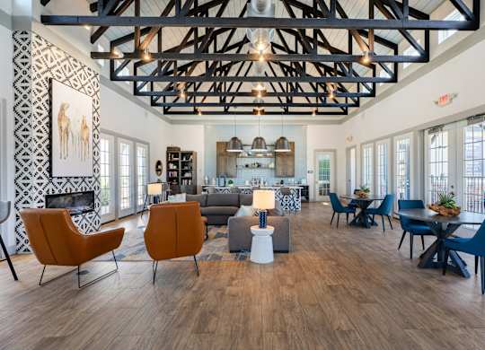 A living room with a fireplace and a dining table.