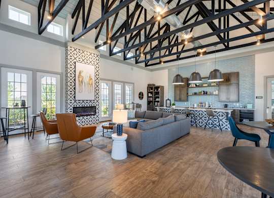A modern living room with a fireplace and a dining table.