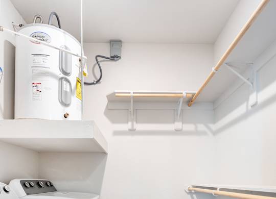 A small laundry room with a washer and dryer.