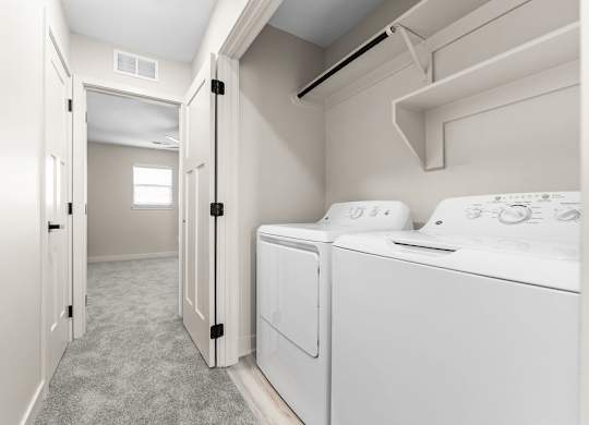 A laundry room with a washer and dryer.