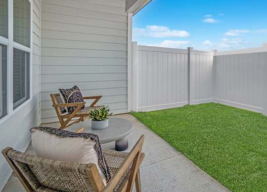 Back patio with fenced in yard.