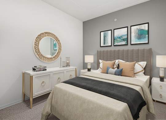 a bedroom with a large bed and a mirror