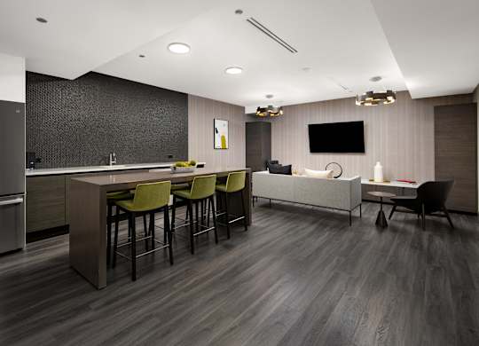 A modern kitchen with a bar area and seating.