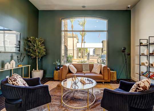 A living room with a large window and a view of the outside.