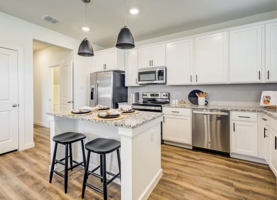 Spacious kitchen with new appliances and hardwood flooring in Willow Park, Texas