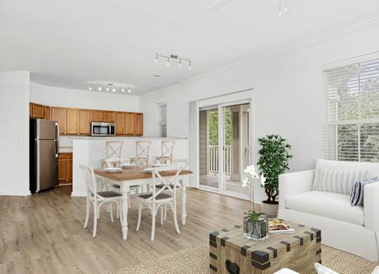 A modern kitchen with a dining table set for six.