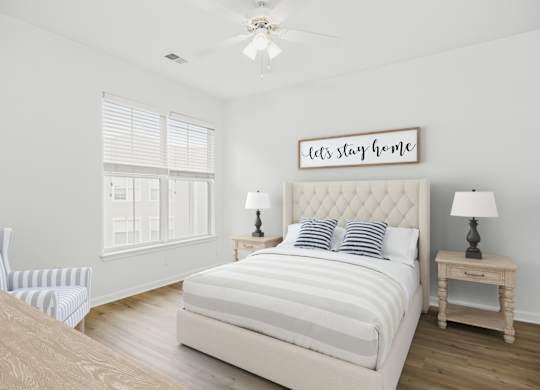 A bedroom with a large bed and a sign that says