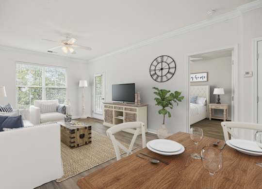 A dining room with a wooden table set for two.