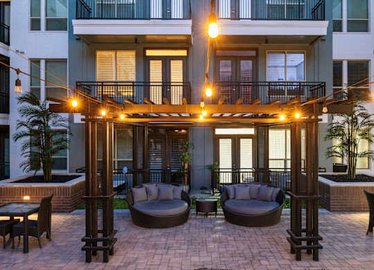 A patio with comfortable furniture at L2 Uptown in Dallas Texas