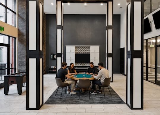 residents playing poker at L2 Uptown in Dallas Texas