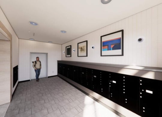 A woman is standing in a hallway with a black counter on the wall.