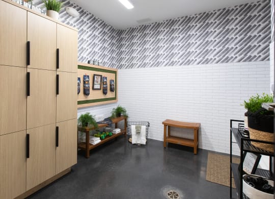 a room with a metal ceiling and a wooden cabinet with plants on top of it