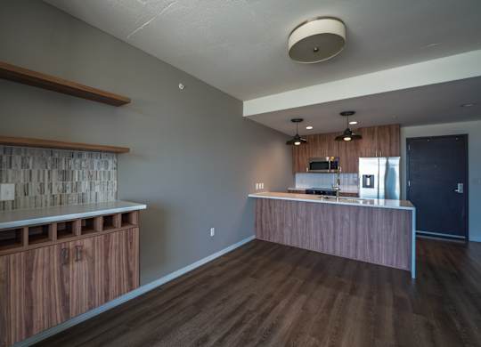 A kitchen with wooden cabinets and a countertop.