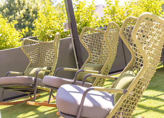 outdoor seating and beautifully  groomed landscaping at Harper Apartments in St Paul, MN