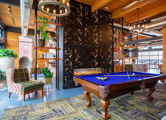 a pool table in the lobby of a house