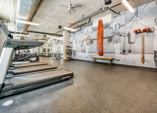 a row of machines in a factory with an engine on the floor
