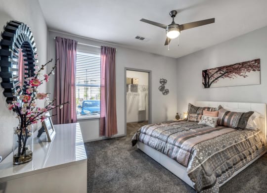 a bedroom with a bed and a window