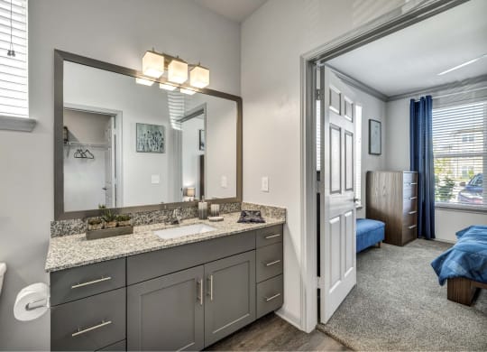 a view of a room with mirrors and counter tops