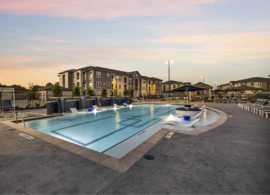 a rendering of a swimming pool with a building in the background