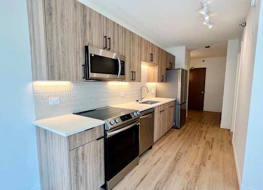 a kitchen with a stove and a microwave