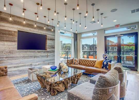 Resident entertainment lounge at the clubhouse at Midway Urban Village Luxury Townhomes and loft apartments in Farmers Branch, Texas near North Dallas. Luxury North Dallas Townhomes for rent