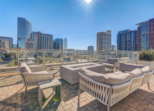 A sunny day in the city with a view of the skyline and modern buildings.