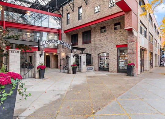 Cobblersquare is a building with a red and white facade.