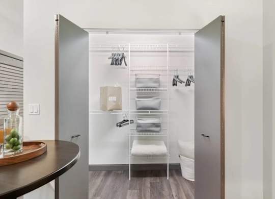 A small bathroom with a towel rack and a towel hanging on it.